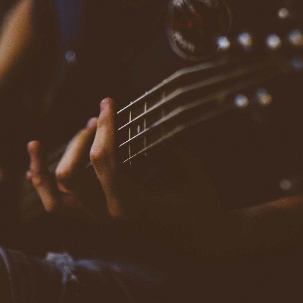 someone playing electric bass