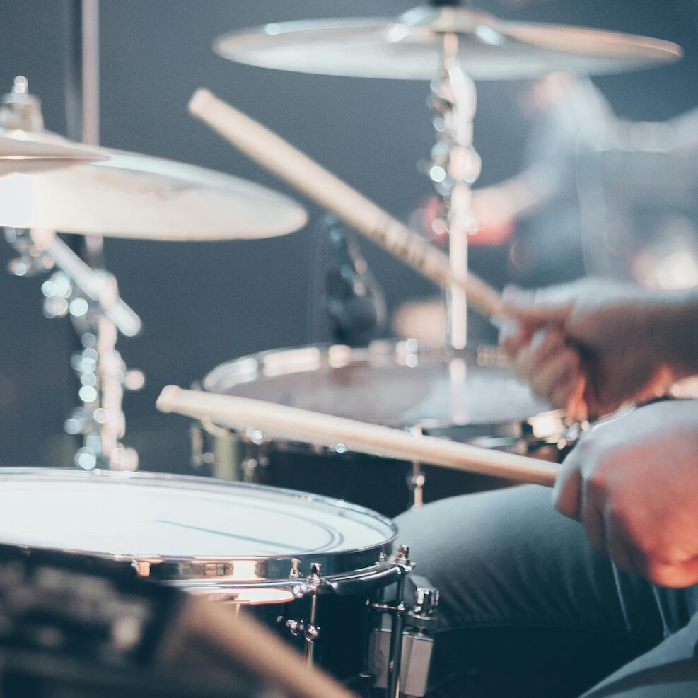 someone playing a drum kit